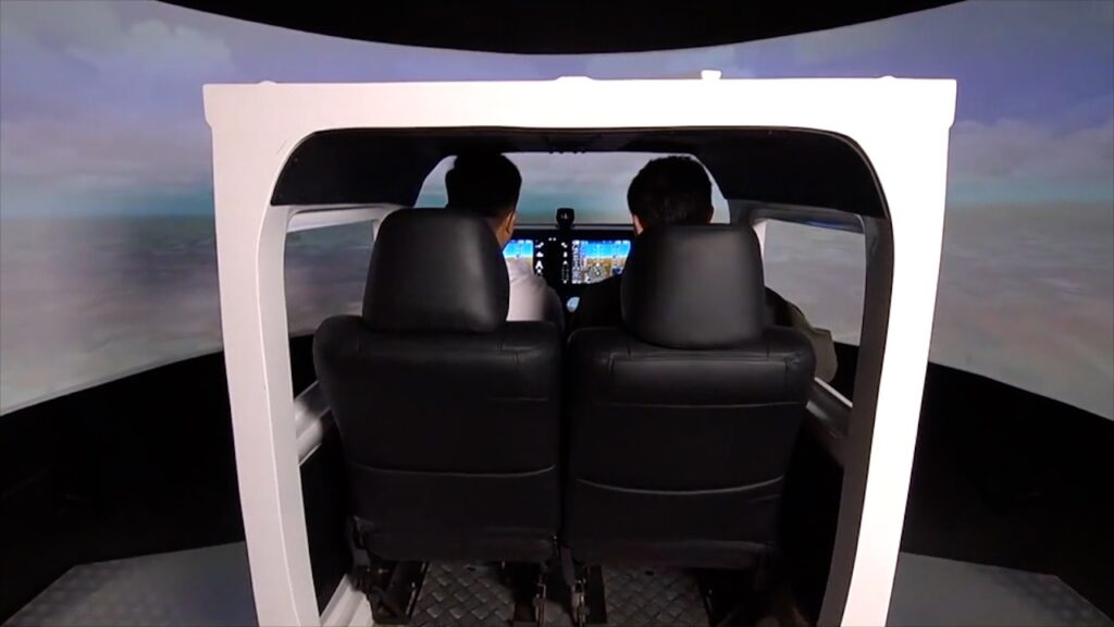 Cadet pilots practicing SOPs in full-flight simulator.