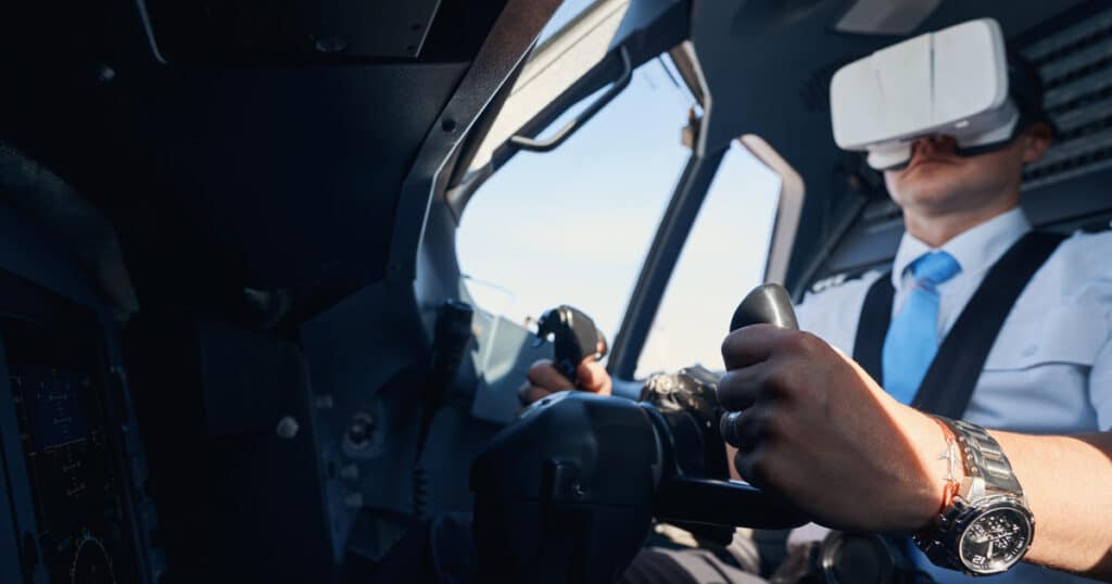 Pilot student wearing VR headset for virtual reality flight training