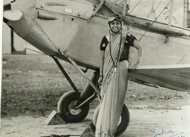 Sarla Thukral, India's first woman pilot, standing beside an aircraft